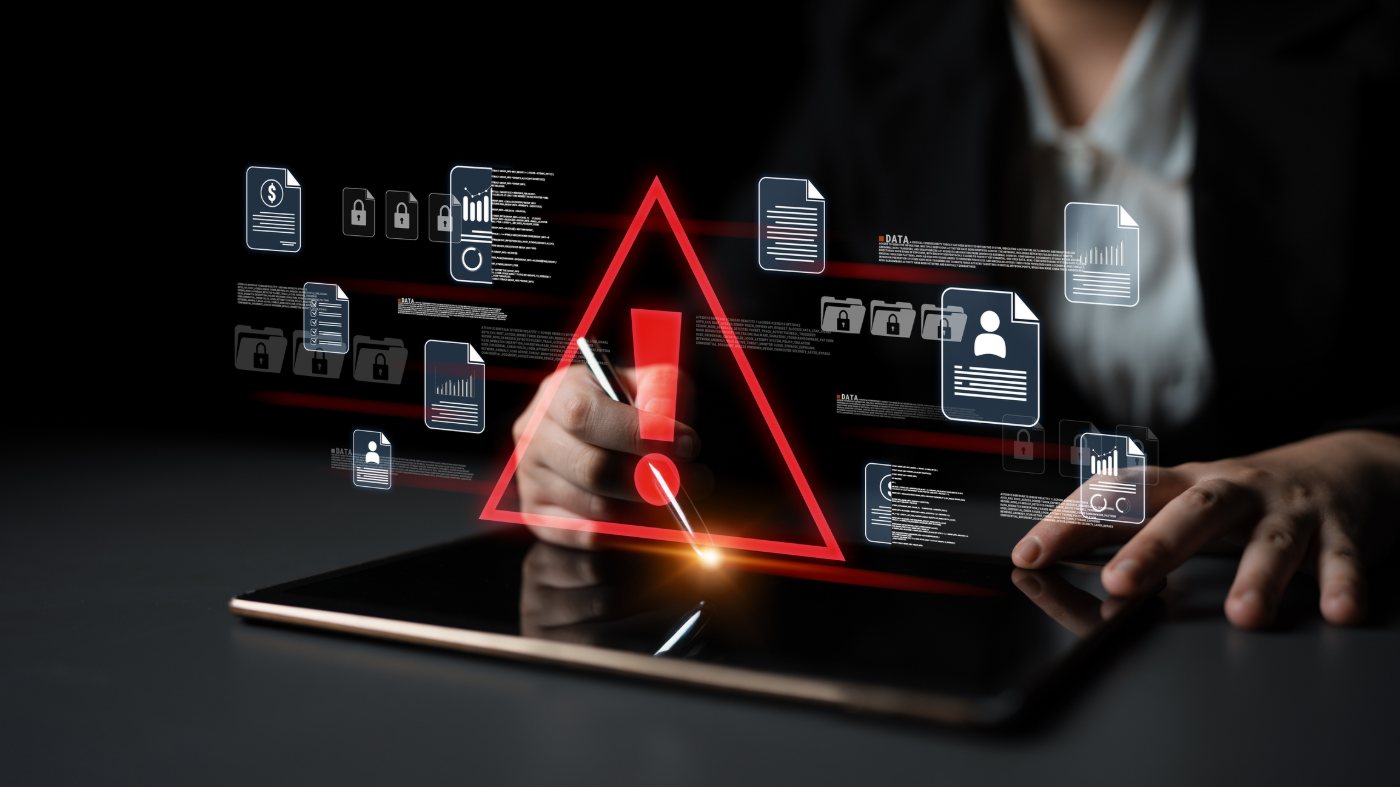 Security alert warning over business data on a tablet